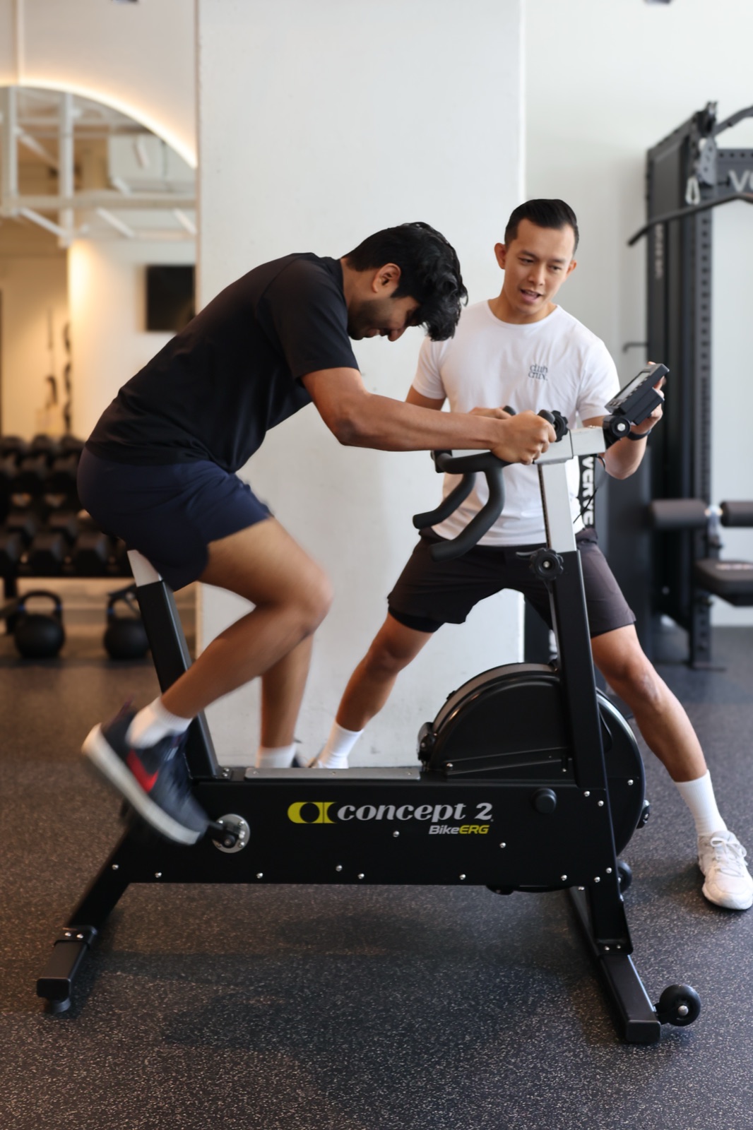 A Club Crux coach guiding a member through a conditioning effort