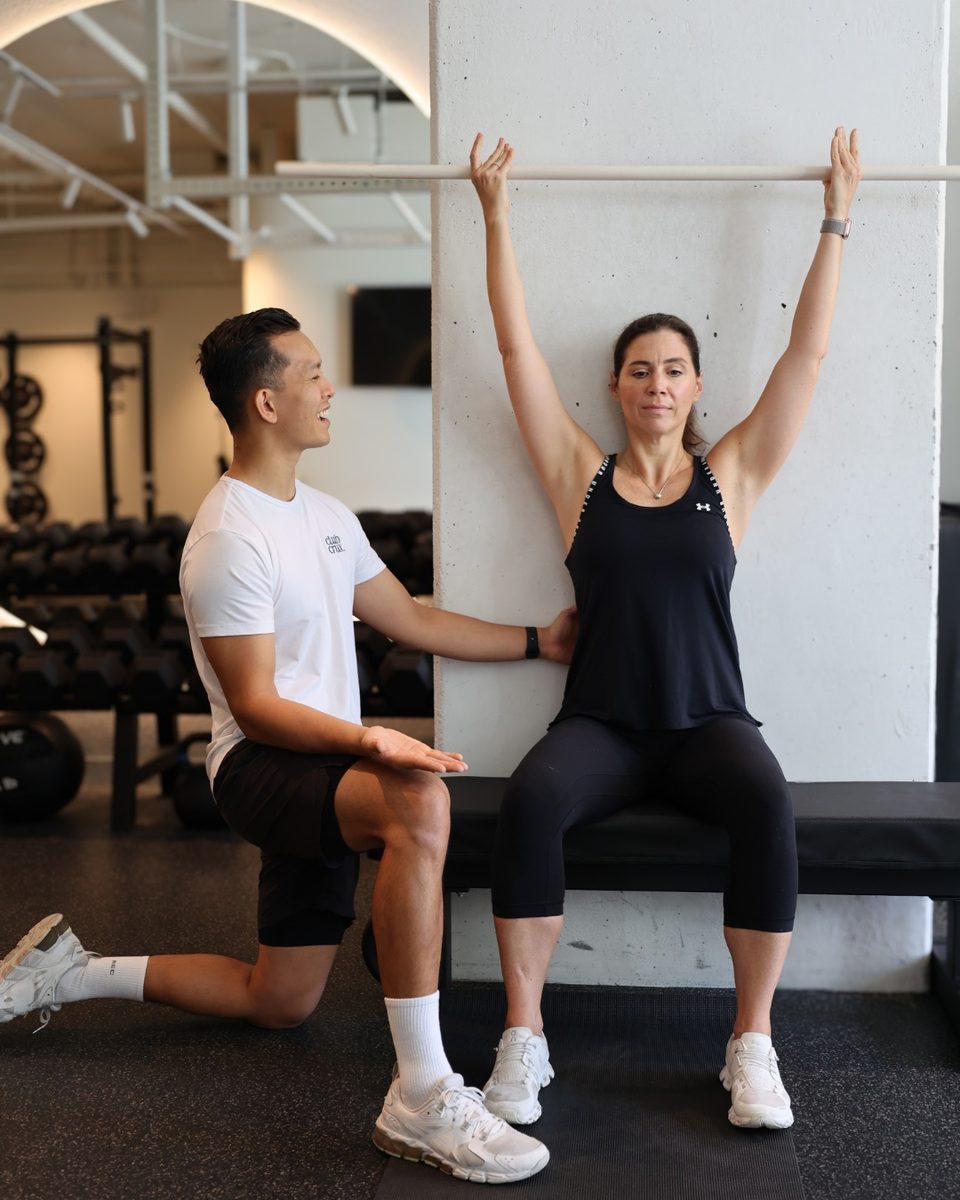 A Club Crux coach working one-on-one with a member in the private South Brisbane studio.